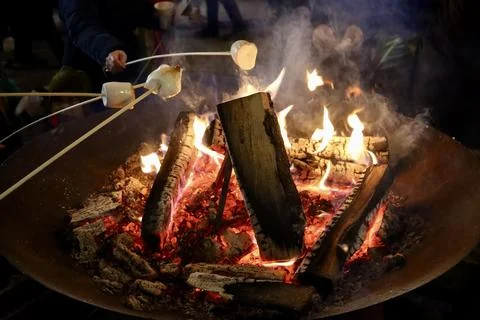 Marshmallows roasting over fire Stock Photos