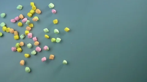 Marshmallows sprinkled on the table Stock Footage 129382249