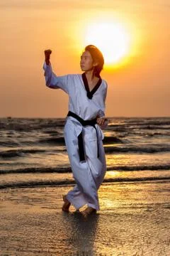 Martial art practicing on beach Stock Photos