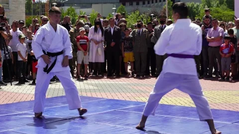 Martial art Taekwondo performers in city center of Tirana, young boys Stock Footage