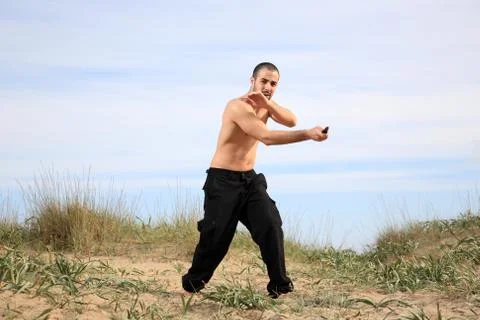 Martial arts instructor with knife Stock Photos