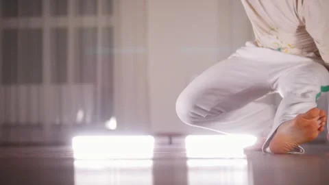 Martial arts. A man performing an acrobatic capoeira attack elements Stock Footage 325345797