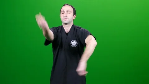 Martial Arts Warming Up on Green Screen Stock Footage 83735801