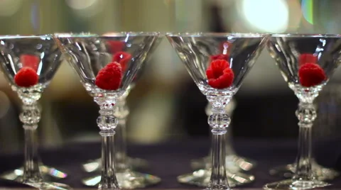 Martini Glasses With Raspberries Video stock 58504960