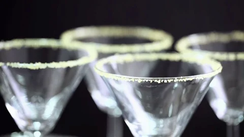 Martini glasses rimmed with brown sugar and set for egg nog cocktail at the mini Stock Footage