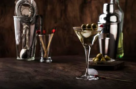 Martini vodka cocktail, with dry vermouth, vodka and green olives, bar tools, Stock Photos