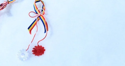Martisor with Romanian tricolor elements on snow texture background. Moldavia Stock Footage 103548480