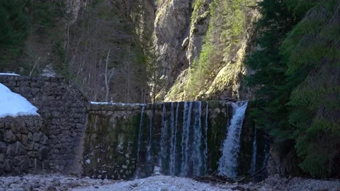 The Martuljek stream flows over man-made cascades Stock Footage 237182872
