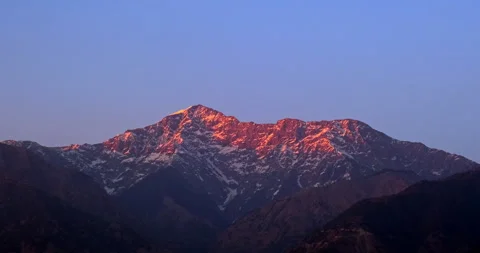 Marvel at the fiery splendor of the Himalayan mountains at sunset Stock Footage 265010036