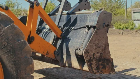 Marvel at the spectacle of an industrial machine at work as a yellow excavator Stock Footage 244462822