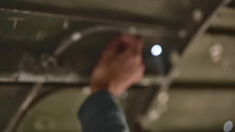 Marvelous Shot of a Hand Scribbling the Inside of a Plane Wreck Ruins Stock Footage 159487859