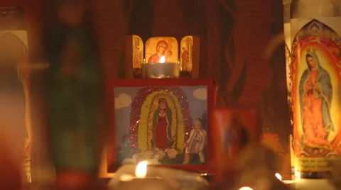 "Mary- Our Lady of Guadalupe candles Alter - in and out of focus Stock Footage