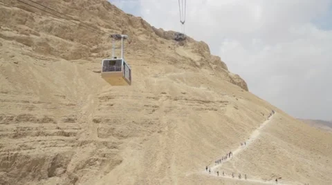 Masada Cableway. Cable car way to canyon and over the tourists. Stock Footage 51111586