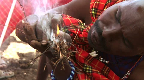 Masai man igniting the fire 2 Stock Footage 33688400