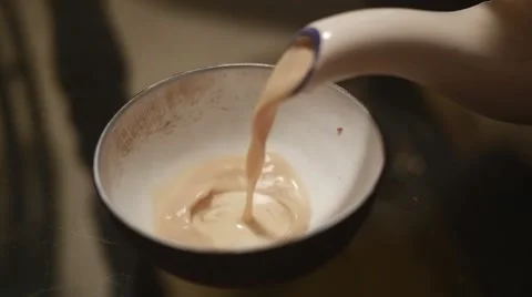 Masala tea being poured in cup in super slow motion Stock Footage 43247801