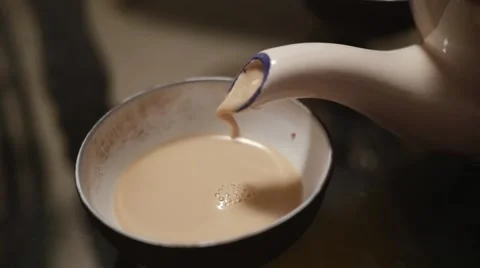 Masala tea being poured in cup in super slow motion Stock Footage 43247804