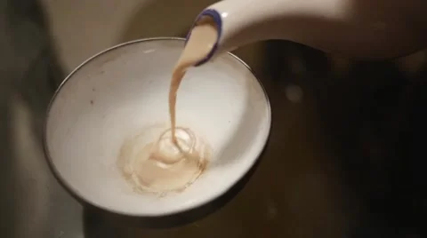 Masala tea being poured in cup in super slow motion Stock Footage 43247806