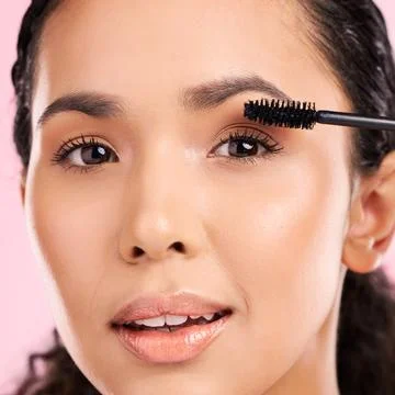 Mascara, beauty and makeup on face of a woman in studio for eyelash cosmetics Stock Photos