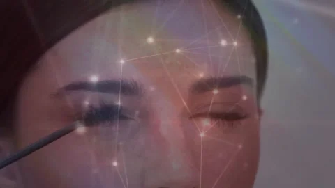 Mascara brush entering model applying mascara for coverage with gliding wand and Stock Footage 314408173