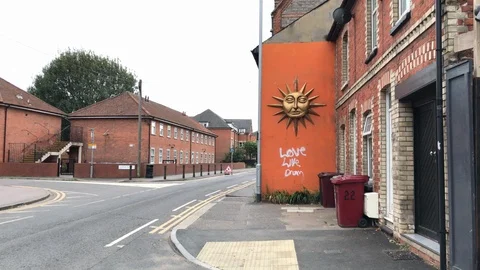 Mascaron of a sun on a side of a building Stock Footage 115611220