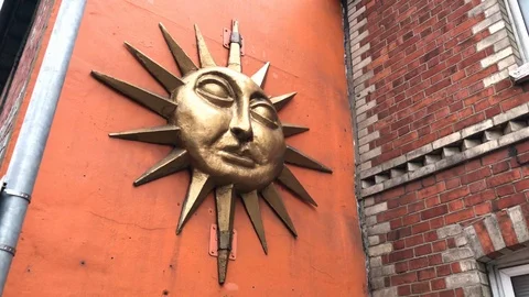 Mascaron of a sun on a wall Stock Footage 115613033