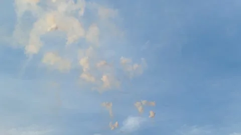 Mascleta fireworks exploding in the bright clear blue sky in the daytime Stock Footage 278213999