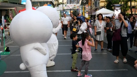 Mascot playing with the passerby Stock Footage 121969641
