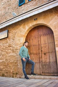 Masculine model in fall clothes in small town in spain Stock Photos