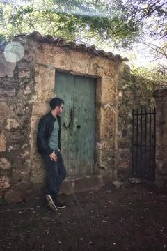 Masculine model in fall clothes in small town in spain Stock Photos