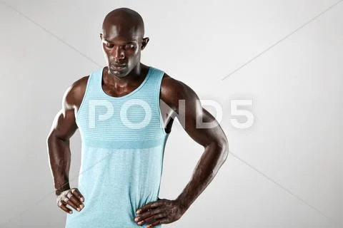 Masculine young african man over grey background Stock Photos