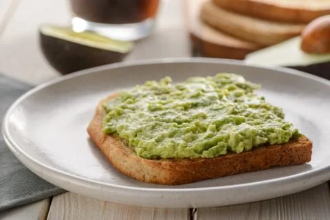 Mashed avocado sandwich Stock Photos