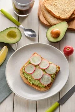 Mashed avocado toast with radish Stock Photos