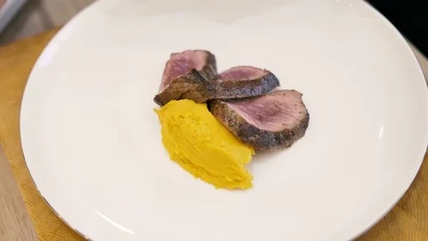 Mashed meat steak and corn on a white plate Stock Footage 125922377