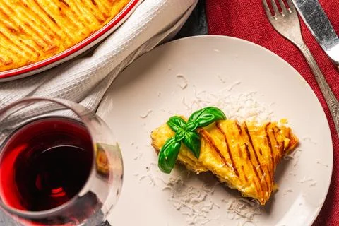 Mashed potato and minced meat casserole in a baking dish and a piece of Stock Photos