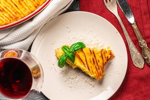 Mashed potato and minced meat casserole in a baking dish and a piece of Stock Photos