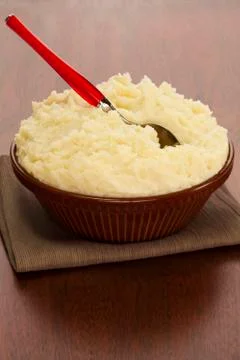 Mashed potato in a brown earthenware bowl Stock Photos