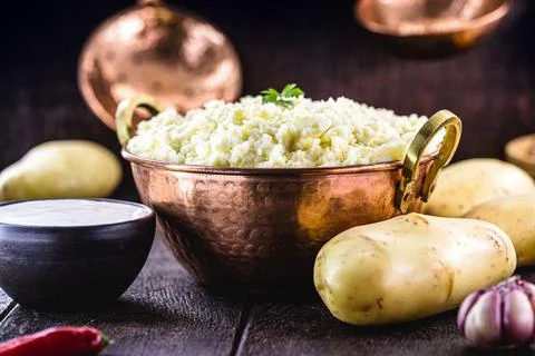 Mashed potato, potato cream in rustic kitchen, in rustic copper pot Stock Photos