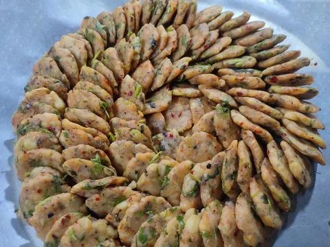 Mashed potato in round shape, ready for cook.Locally called Alur Chop. Stock Photos