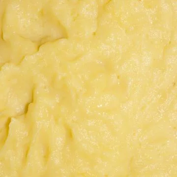 Mashed potato texture.Homemade mashed potatoes.Boiled grated potatoes. Stock Photos