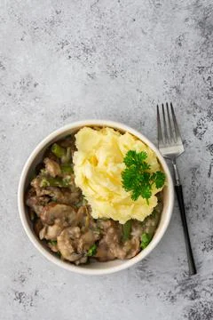 Mashed potatoes and fried champignons mushrooms Stock Photos