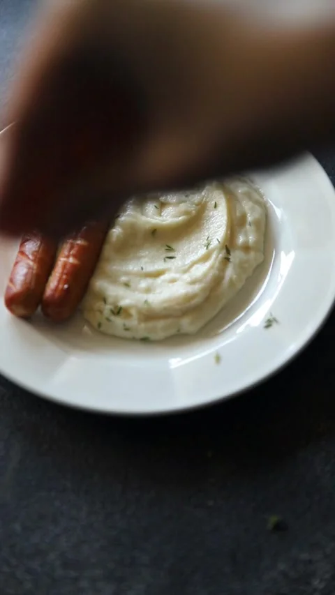 Mashed potatoes and fried sausages food second course dish fresh gourmet Stock Footage 297710080