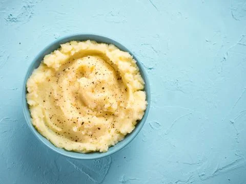 Mashed potatoes on blue concrete background Stock Photos
