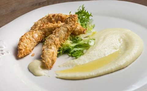 Mashed potatoes with chicken strips Stock Photos