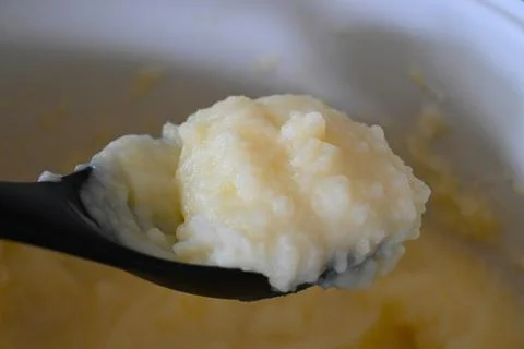Mashed potatoes close up on a spoon Stock Photos