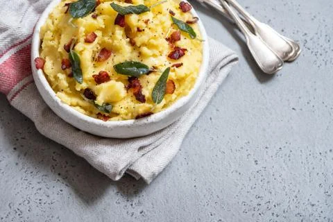 Mashed potatoes with crispy bacon and sage Stock Photos