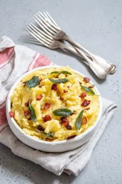Mashed potatoes with crispy bacon and sage Stock Photos