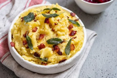 Mashed potatoes with crispy bacon and sage Stock Photos