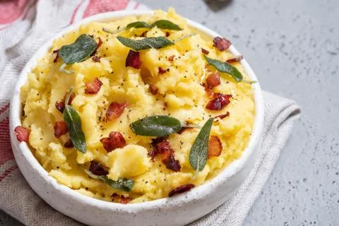 Mashed potatoes with crispy bacon and sage Stock Photos