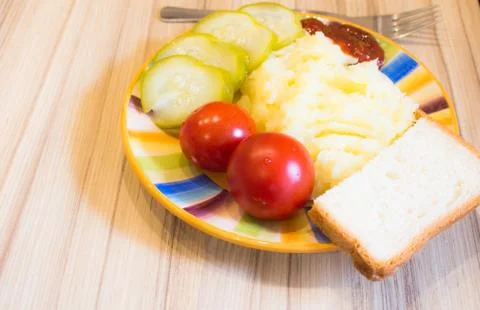 Mashed potatoes with cucumber on the plate Stock Photos