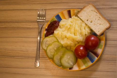 Mashed potatoes with cucumber on the plate Stock Photos